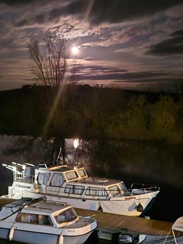 a group of boats docked in the water at night at Killynick Glamping Oiney Fishing County Fermanagh in Enniskillen