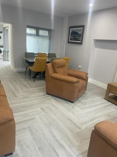 a living room with a couch and a table at Ballyshannon Stone Town House in Ballyshannon