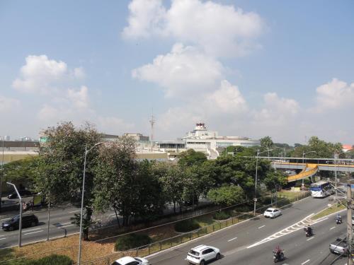 a city street with cars driving on a highway at Hotel Nobrega - São Paulo - Aeroporto Congonhas in Sao Paulo