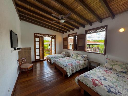 Postel nebo postele na pokoji v ubytování Casa Santa Rita - Tres Habitaciones