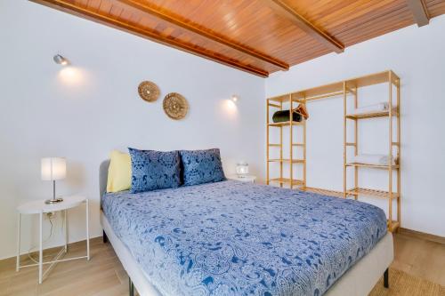 Postel nebo postele na pokoji v ubytování Casa Ramiro II Escapadinha na Ilha da Culatra