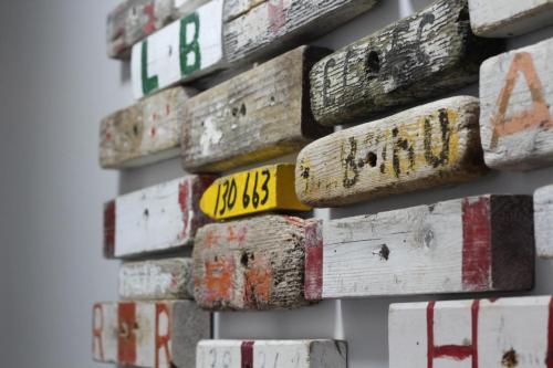 a bunch of wine bottles hanging on a wall at Parkers Bluewater Inn in Pilleyʼs Island