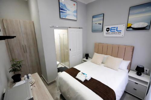 Ένα ή περισσότερα κρεβάτια σε δωμάτιο στο El Guest Lodge & Spa