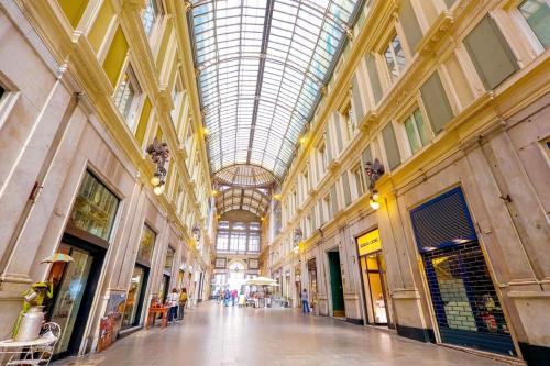 a hallway in a building with a glass ceiling at Central-Luxury Free Wi-Fi, AC in Genova