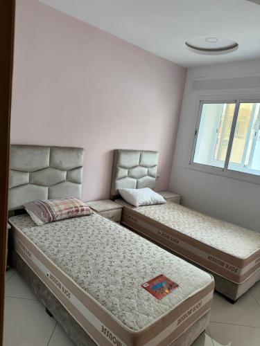 Postel nebo postele na pokoji v ubytování Oumaira Residence Azla-Tetouan