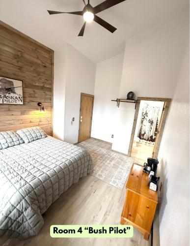 a bedroom with a bed and a ceiling fan at Lake Louise Lodge, Alaska in Glennallen