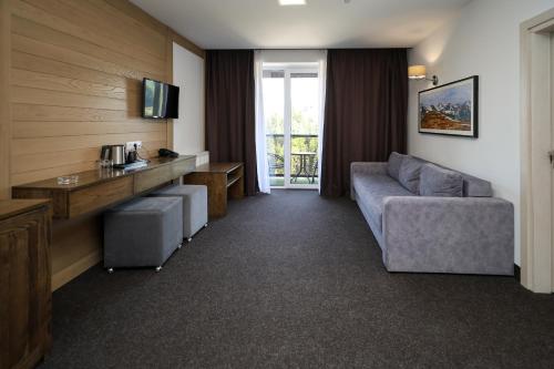 TV a/nebo společenská místnost v ubytování VILSON hotel