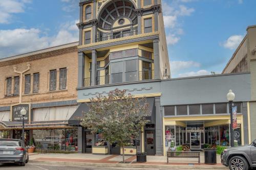 a building with a clock tower on top of it at Stylish Private Balcony Downtown Marshall Studio! in Marshall