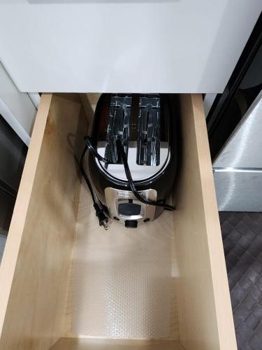 a boat in a box with wires in it at Gorgeous Two Bedroom Suite in a Quiet, Picturesque Neighborhood! in West Vancouver