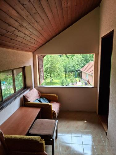a living room with a couch and a table at Vila Petrov in Lukavica