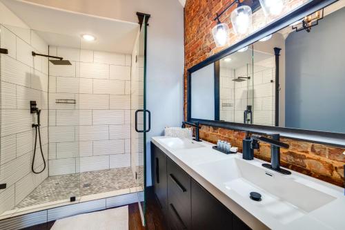 a bathroom with two sinks and a shower at Studio with Private Balcony in Downtown Marshall! in Marshall