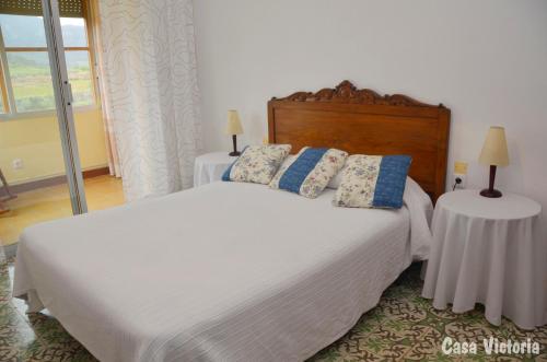 מיטה או מיטות בחדר ב-Casa Victoria