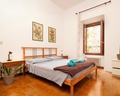 Ένα ή περισσότερα κρεβάτια σε δωμάτιο στο Casa di Elia