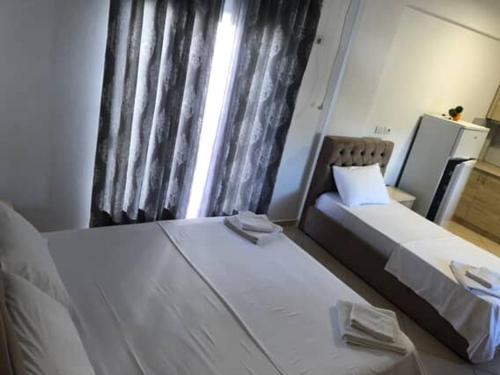 Postel nebo postele na pokoji v ubytování Vila Eri Ksamil