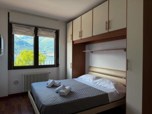 Ένα ή περισσότερα κρεβάτια σε δωμάτιο στο casa Venere - lake view terrace