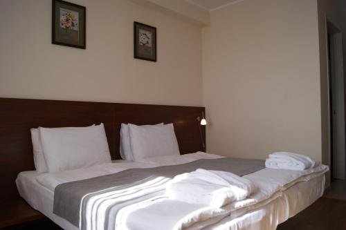 Postel nebo postele na pokoji v ubytování Monte Hotel