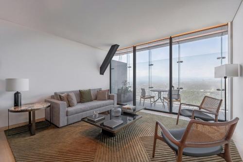 a living room with a couch and a table at The Ritz-Carlton, Mexico City in Mexico City