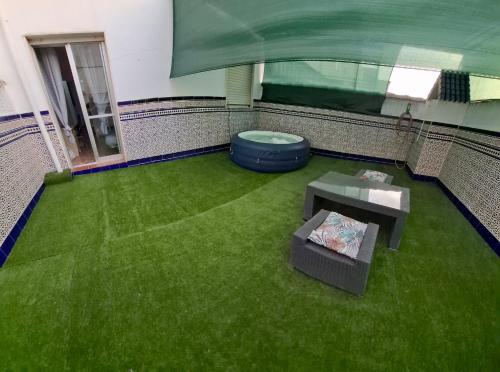 an overhead view of a room with green grass at Casa Paco in Linares