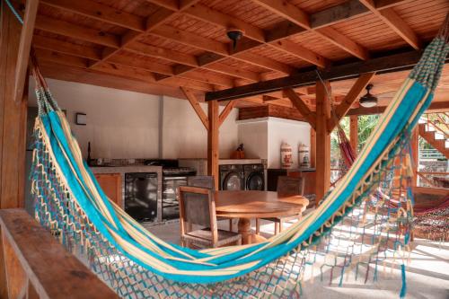a hammock in the kitchen of a house at Star Apple Inn in San Andrés