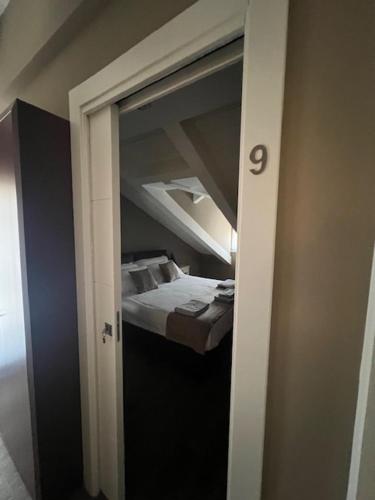 Una cama o camas en una habitación de Magno B&B