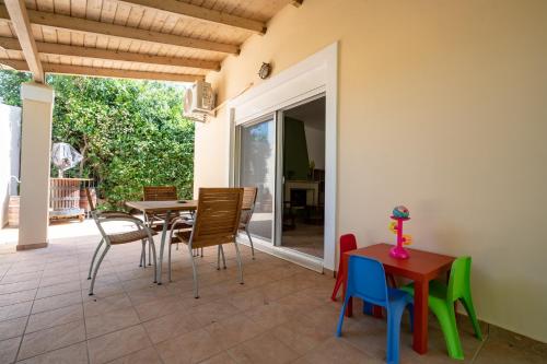 a dining room with a table and chairs at G&A Family Home near the Beach by MΡS in Nea Makri