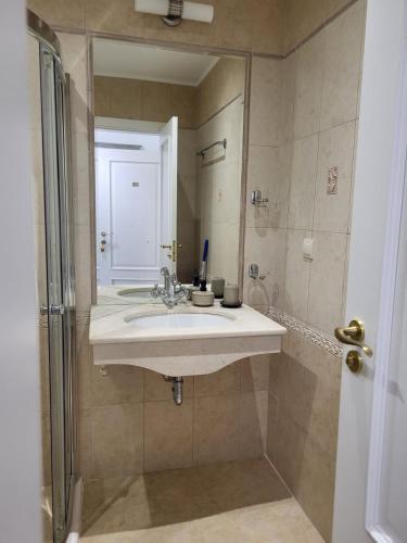 a bathroom with a sink and a mirror at Solea Studio in Chernomorets