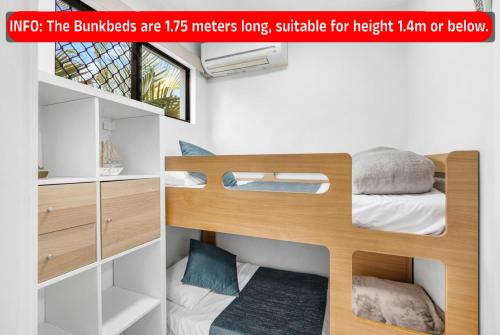 a poster of a bunk bed in a room at Mooloolaba Beach Club Paradise 2 Bedroom Apartment in Mooloolaba