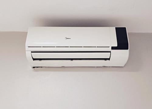 a white printer sitting on top of a wall at Solar Hostel Centro in Rio de Janeiro