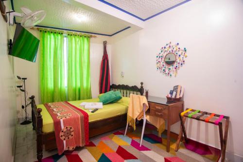 Postel nebo postele na pokoji v ubytování Antigua Hostal