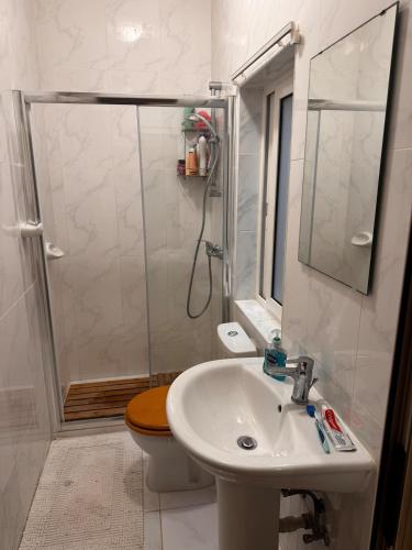 a bathroom with a shower and a sink and a toilet at Wake up to the gorgeous sunrise in Marsalforn
