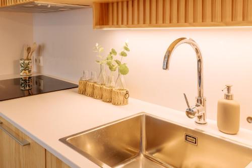 a kitchen counter with a sink in a kitchen at Real Villa I by Mycelia 