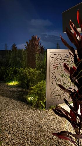 a box in a garden at night with a plant at La Font Ecolodge in Buenavista
