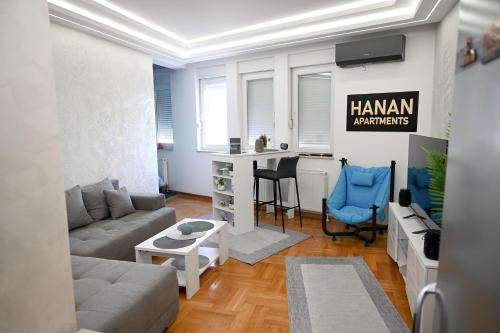 a living room with a couch and a table at Hanan Apartmani in Novi Pazar