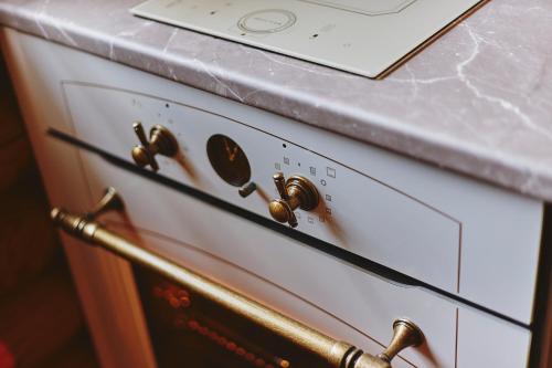 a close up of an oven with a counter at Slow House Gaładuś in Radziucie