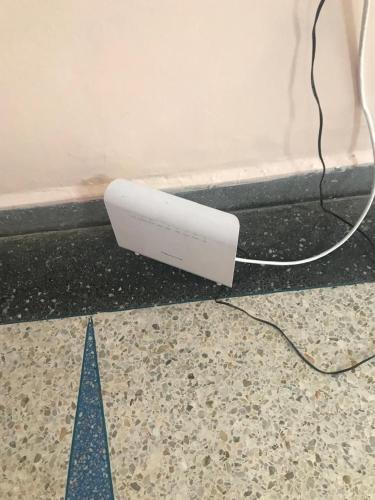 a white object sitting on the floor next to a wall at Dar aziz in Essaouira