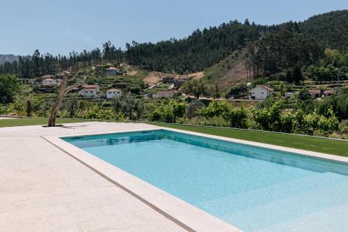 a swimming pool with a view of a mountain at Real Villa II by Mycelia 