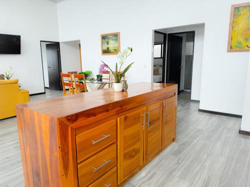 a large wooden cabinet in a living room at Canavida Villas & Resort in Uvita
