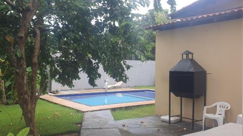 Swimmingpoolen hos eller tæt på Casa 5 quartos Aluguel Temporada Residencial Mirandinha