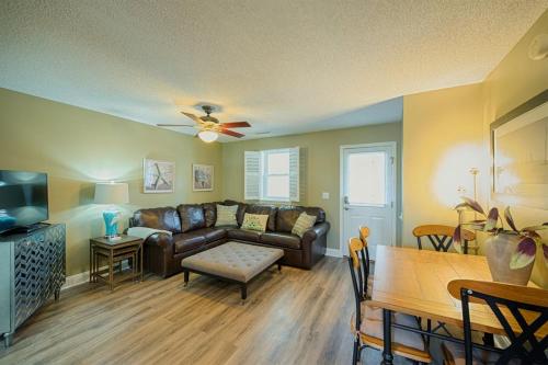 a living room with a couch and a table at Windy Hill Villa 1 - Beach Barnacle in Myrtle Beach