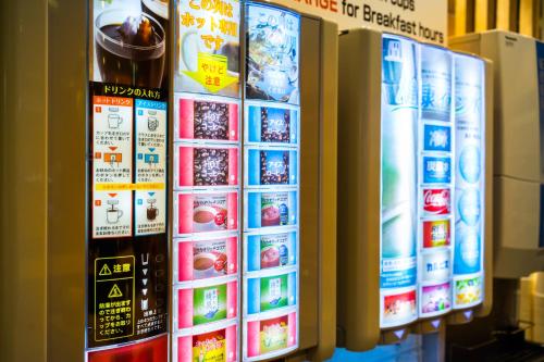 a refrigerator with many different types of food and drinks at SUPERHOTEL Matsumoto Oshiroguchi in Matsumoto