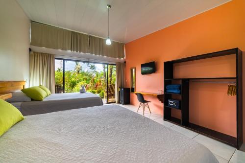 Postel nebo postele na pokoji v ubytování Hotel Secreto La Fortuna