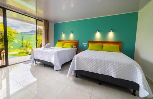 Katil atau katil-katil dalam bilik di Hotel Secreto La Fortuna