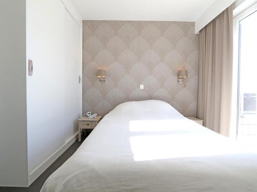 Ένα ή περισσότερα κρεβάτια σε δωμάτιο στο Penthouse in Knokke near Beach and Lippenslaan