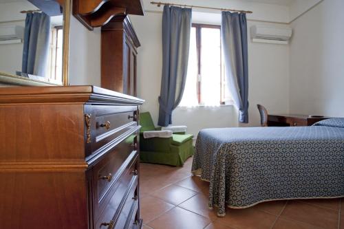 Postel nebo postele na pokoji v ubytování Albergo Stella
