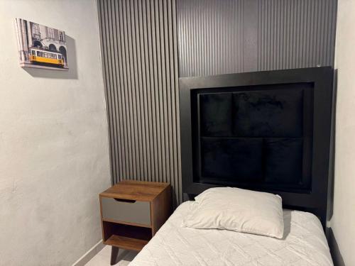 Una cama o camas en una habitación de El Hostalito Metepec