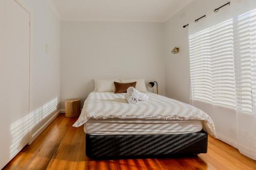Ένα ή περισσότερα κρεβάτια σε δωμάτιο στο Cute, Comfy, Family and Pet friendly