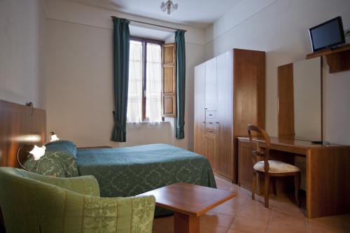 Postel nebo postele na pokoji v ubytování Albergo Stella