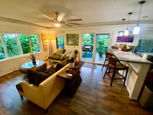 a living room with a couch and a table at Gated Tropical Estate in Kailua Kona with Hot Tub in Kailua-Kona