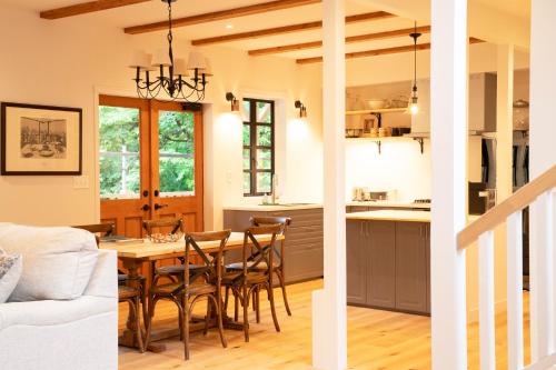 a kitchen and dining room with a table and chairs at Hayama Farmstead Inn in Hayama
