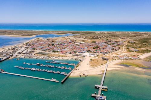 Photo de la galerie de l'établissement Casa Ramiro T2 Paradisíaco entre o Mar e a Ria, à Ilha da Culatra